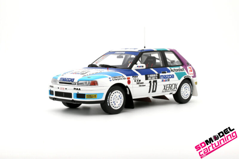 1:18 Mazda 323 GTX Gr.A #10 T. Mäkinen - Rallye des 1000 Lacs - 1991